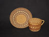 Hupa cup and saucer with a design negative
