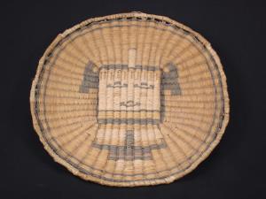 A Hopi wicker tray decorated with a  Kachina