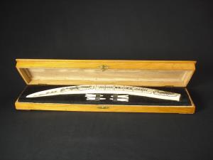 An Eskimo scrimshaw cribbage board