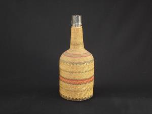 A Makah basketry covered bottle